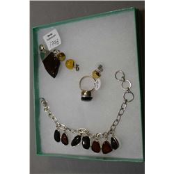 Selection of brand new sterling silver including red cherry amber pendant, bracelet and ring plus a 