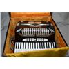 Image 2 : Bundy trumpet in hard case and a Rossini accordion in hard case