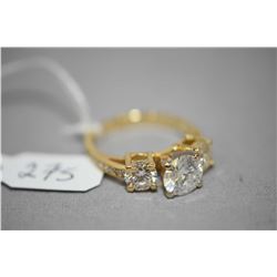 Ladies 14kt yellow gold three stone diamond ring set with 1.51ct center stone and 1.15cts of shoulde