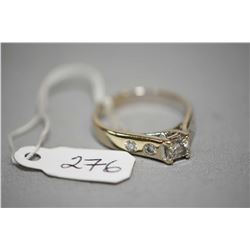 Ladies 14kt white gold and diamond ring set with 0.50ct princess cut and 0.28cts of brilliant white 