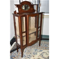 Antique Sheraton display cabinet with single center door, glass on three sides, and bevelled mirrore