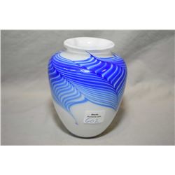 Hand signed Skookum milk glass with cobalt feather swirl vase, 5" in height