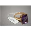 Image 1 : Ladies 10kt yellow gold and amethyst ring, set with 10.00ct faceted rectangular shaped amethyst. Ret