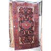 Image 1 : 100% wool carpet with overall geometric pattern, multiple border, stylized foliage, center medallion