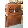 Image 1 : Art Deco walnut china cabinet with drawer and doors in base and two doors with round glass panes and