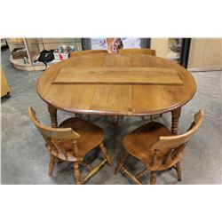 ROUND MAPLE DINING TABLE WITH 2 LEAFS AND FOUR CHAIRS