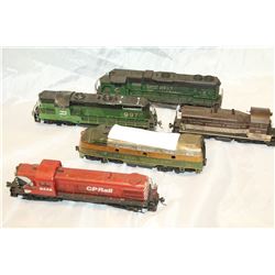 FIVE TOY TRAIN CARS