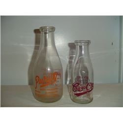 2 Saskatchewan advertising milk bottles