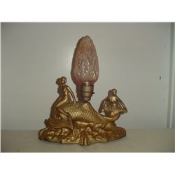 early cast figural electric lamp