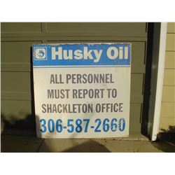 large metal husky oil site sign