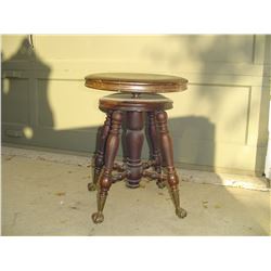 glass ball and claw footed piano stool