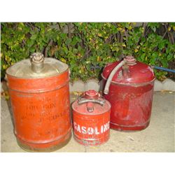 3 old gas containers