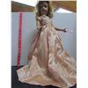Image 1 : 18 inch tall vintage doll in peach dress on stand