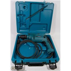 MAKITA HAMMER DRILL IN THE CASE.