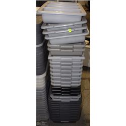 STACK OF PLASTIC DISH TUBS AND CUTLERY TRAYS