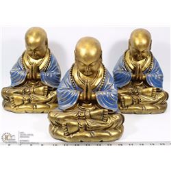 LOT OF 3 PRAYING MONK ORNAMENTS.