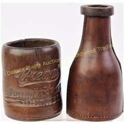 Collection of 2 dice cups includes early leather whiskey advertising cor Cream Whiskey the second in