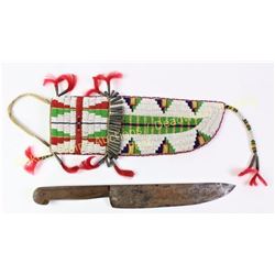 Large Sioux beaded knife sheath with knife. Sheath finely beaded in small seed beads with classic ge