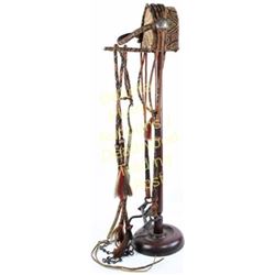 Early hitched horsehair bridle in geometric patterns, Mexican coin conchos, horse hair tassels and m