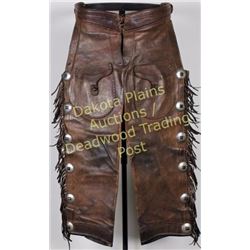 Fred Mueller stamped cowboy shotgun chaps, fringed, 6 cohchos on each leg with outside pockets, chap