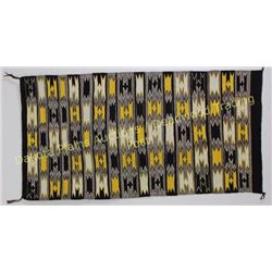 Nicely accomplished Navajo rug in geometric patterns, browns, yellow and white, 27" X 54", shows exc