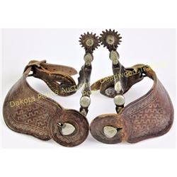 Unmarked McChesney double mounted spurs with 1 1/8"shanks, 1" saw tooth rowels and heart buttons. In