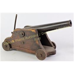 19th C small cannon on wood carriage, barrel 12" overall 15". Bore approx .68 cal.  Est. 600-900