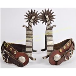Rex Schnitger spurs (1877-1977) single mounted spurs with 1" heel bands, 2 3/4" shanks and 16 point 