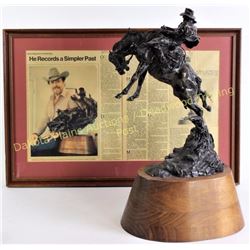"Surprise" bronze by cowboy artist of America Herb Mignery. Mounted on walnut base stands 20" tall, 