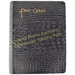 Post card album in black crocodile leather with 40 pages of postcards dating 1907-1910.  Est. 100.-2