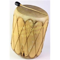 Large contemporary wooden Indian drum with stretched rawhide heads and beater, 19" tall.  Est. 150-2