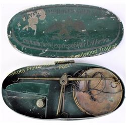 Tin cased gold miners scale the top reads "Miners Improved Gold Scale Manufactured Expressly for Cal