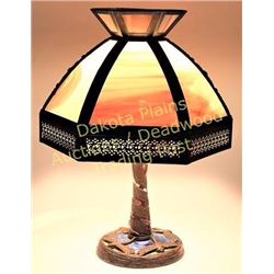 Table lamp with bronze dragonfly base and 6 panel bent glass shade.  Est. 125-200