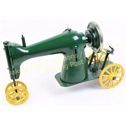 Unique repurposed singer sewing machine crafted into a farm tractor, 18" long.  Est. 150-250