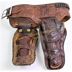 Heiser stamped double buscadero holster rig fitting Colt SA 4 3/4 or 5 1/2" .32 caliber.  Est. 150-3