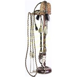 Hitched horsehair bridle in white, black and brown with tassels, round cheeks, close reins and great