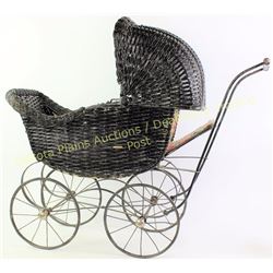 Antique Victorian wicker doll buggy showing very good condition, complete, 29" tall.  Est. 75-175
