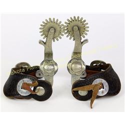 Crockett stamped single mounted spurs very good with 2 piece leather straps.  Est. 150-300