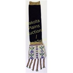 Sioux beaded pipe bag 33" long including tabs with blue trade cloth throad, C. 1900's.  Est. 650-120