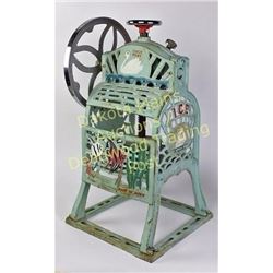 Cast iron counter top ice shaver in good working order.  Est. 100-250