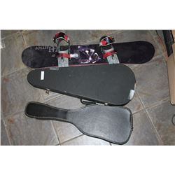 TWO LEATHER GUITAR CASES AND SNOWBOARD