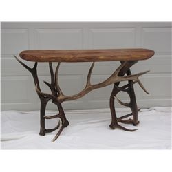 Gorgeous hand crafted sofa table made from elk antlers with a mesquite wood top. Since the late 80's