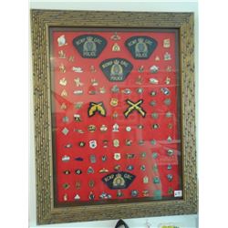 Huge Framed lot of (97) RCMP pins,patches 20x26