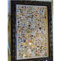 Framed lot of pins 19x28