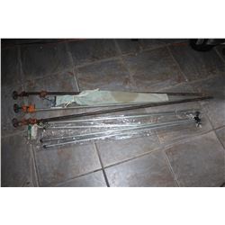 FOUR NEW EXTENTION AWNING POLES AND THREE FIVE FOOT BAR CLAMPS