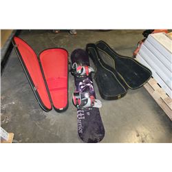 TWO LEATHER GUITAR CASES AND SNOWBOARD