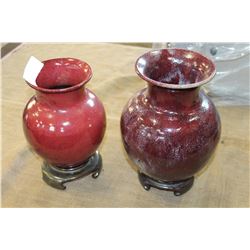 PAIR OF STAMPED VASES ON PEDESTLES