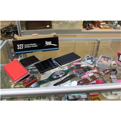 BOX OF SPORTS CARDS VAPE CASES WRIST BANDS AND FOSSIL WATCH