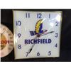 Image 2 : 2 VINTAGE WALL MOUNT LIGHT UP CLOCKS, LEAK-PROOF MADE IN USA, AND RICHFIELD OIL, 12'' AND 15'' WIDE