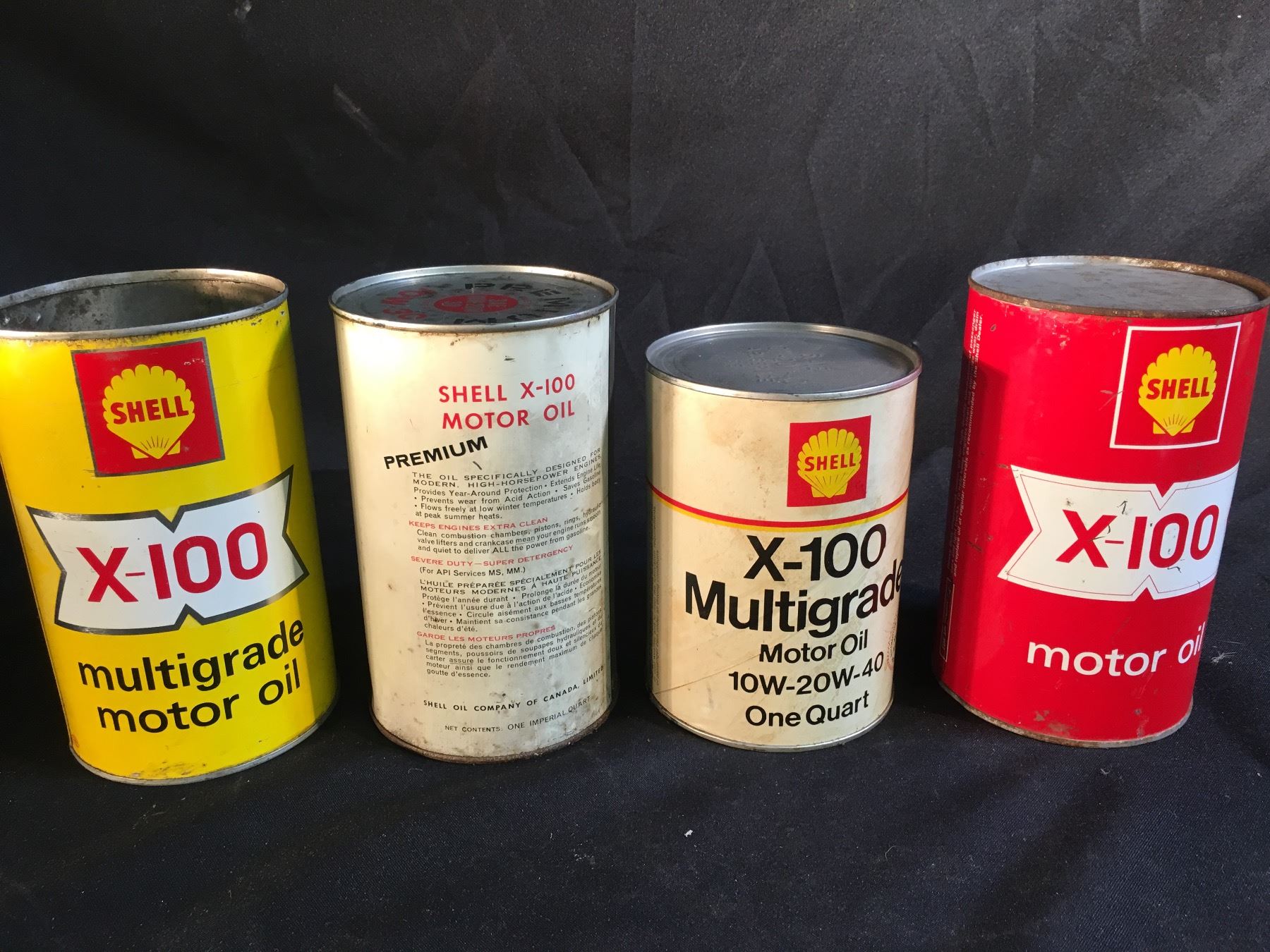 COLLECTION OF 4 VINTAGE SHELL OIL X-100 OIL CONTAINERS